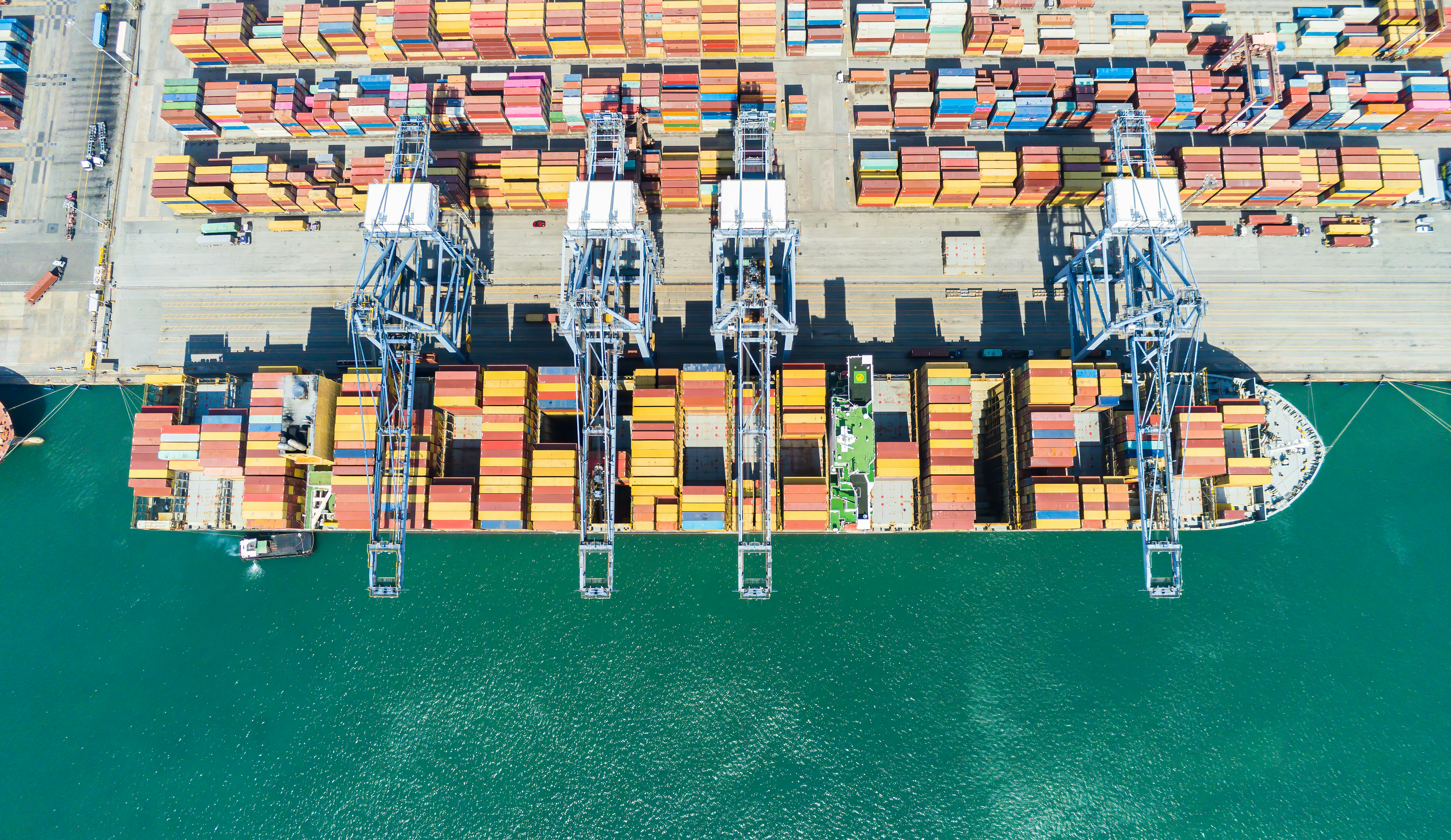 Cargo ship at port representing Five Star Transportation's freight forwarding services